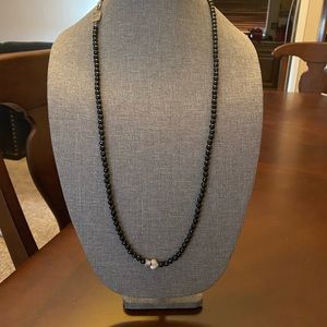 King baby simple strand of black onyx beads with King Baby pave heart.